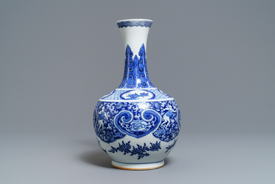 A Chinese blue and white bottle vase with dancers on a floral ground, 19th C.