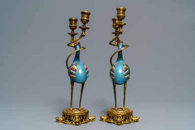 A pair of Chinese cloisonn&eacute; gilt bronze candelabra mounted cranes, 18/19th C.