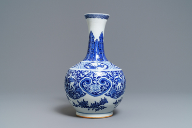 A Chinese blue and white bottle vase with dancers on a floral ground, 19th C.