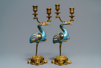 A pair of Chinese cloisonn&eacute; gilt bronze candelabra mounted cranes, 18/19th C.