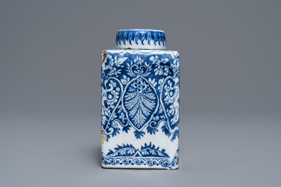 A Dutch Delft blue and white tea caddy with screw cap, late 17th C.