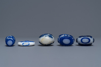 Nine various Chinese blue overlay glass snuff bottles, 19/20th C.