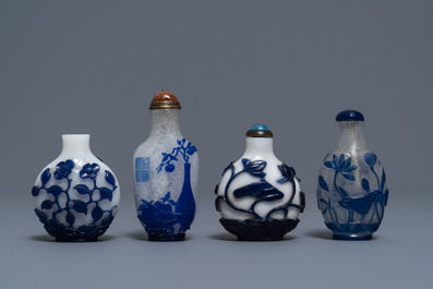 Nine various Chinese blue overlay glass snuff bottles, 19/20th C.