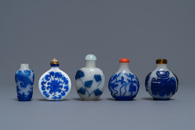 Nine various Chinese blue overlay glass snuff bottles, 19/20th C.