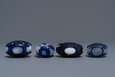 Nine various Chinese blue overlay glass snuff bottles, 19/20th C.