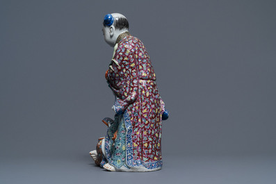 A Chinese famille rose group of two children, impressed marks, Republic, 20th C.