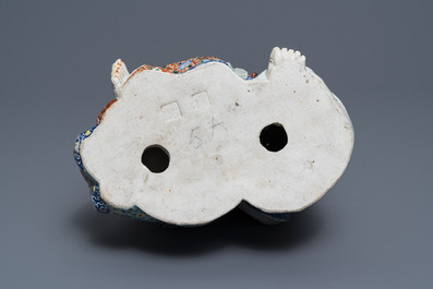 A Chinese famille rose group of two children, impressed marks, Republic, 20th C.