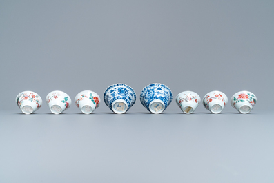 Eight Chinese blue and white and famille rose cups and saucers and three plates, Kangxi/Qianlong