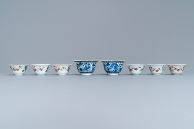 Eight Chinese blue and white and famille rose cups and saucers and three plates, Kangxi/Qianlong