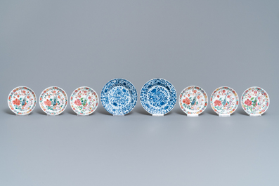 Eight Chinese blue and white and famille rose cups and saucers and three plates, Kangxi/Qianlong