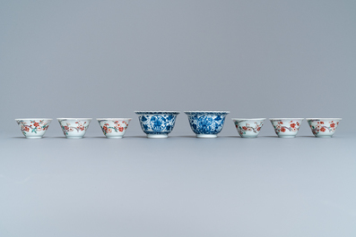 Eight Chinese blue and white and famille rose cups and saucers and three plates, Kangxi/Qianlong