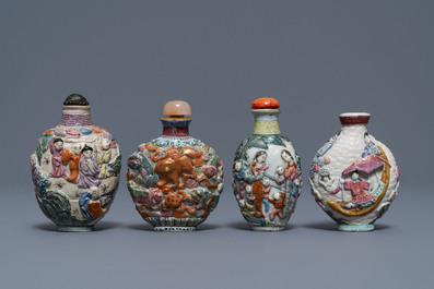 Four Chinese famille rose porcelain relief-decorated snuff bottles, 19th C.