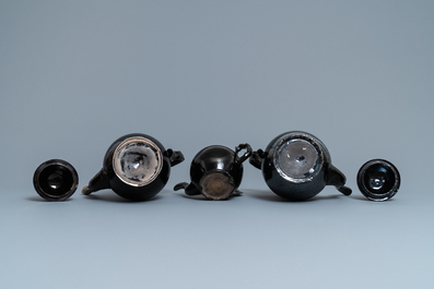 Four silver-mounted Namur black-glazed pottery coffeepots and a teapot, 18th C.