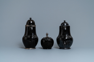 Four silver-mounted Namur black-glazed pottery coffeepots and a teapot, 18th C.