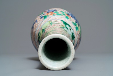 A Chinese wucai bottle vase with birds in a garden, Transitional period