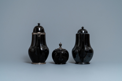 Four silver-mounted Namur black-glazed pottery coffeepots and a teapot, 18th C.