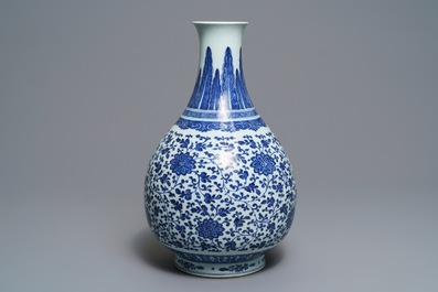 A Chinese blue and white 'peony scroll' bottle vase, Qianlong