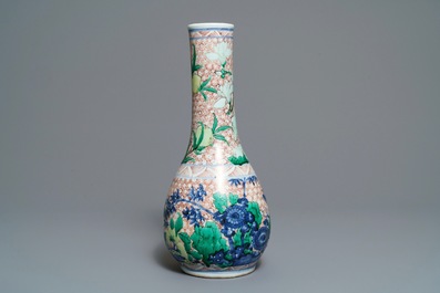 A Chinese wucai bottle vase with birds in a garden, Transitional period