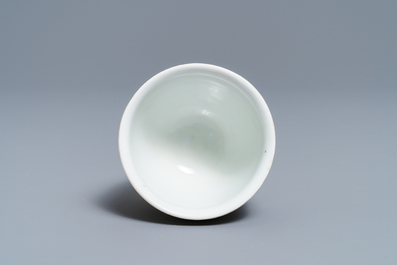A reticulated Chinese famille rose cup and saucer, Qianlong