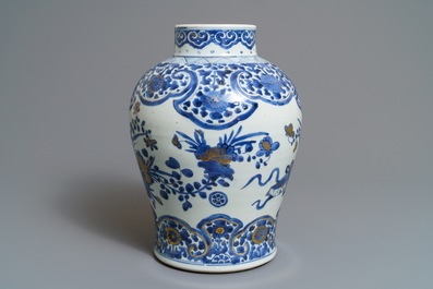 A Chinese gilt-decorated blue and white vase with floral design, Kangxi