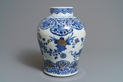 A Chinese gilt-decorated blue and white vase with floral design, Kangxi