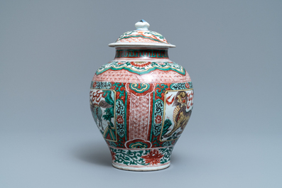 A Chinese wucai &lsquo;mythical beasts&rsquo; vase and cover, Transitional period