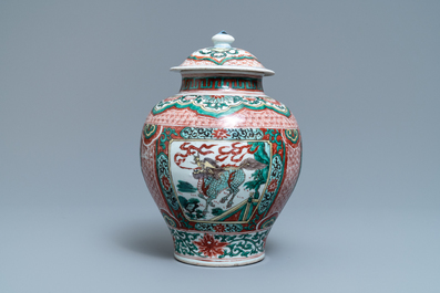 A Chinese wucai &lsquo;mythical beasts&rsquo; vase and cover, Transitional period