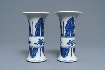A pair of Chinese blue and white 'gu' vases, Kangxi