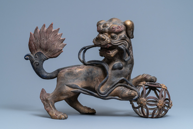 A pair of large Chinese gilt-lacquered bronze Buddhist lions, 19th C.
