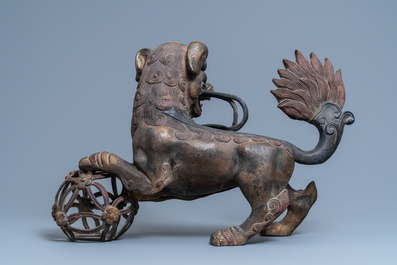 A pair of large Chinese gilt-lacquered bronze Buddhist lions, 19th C.