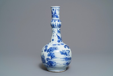 A Chinese blue and white bottle vase with figures in a landscape, Transitional period