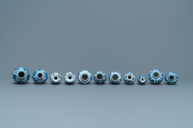 Eleven small Chinese blue and white vases with floral design, Kangxi