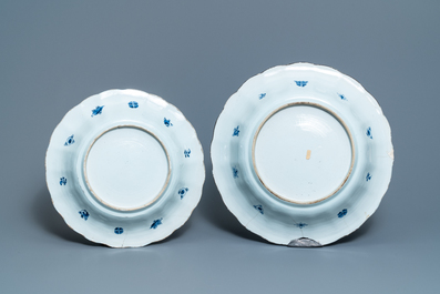 Two Chinese blue and white gadrooned 'crabs and carps' dishes and a pair of plates, Kangxi