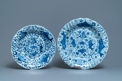Two Chinese blue and white gadrooned 'crabs and carps' dishes and a pair of plates, Kangxi
