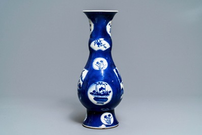 A Chinese powder blue-ground vase with landscape medallions, Kangxi