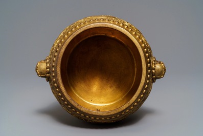 A Chinese gilt bronze tripod censer with buddhist lions, Qianlong mark, 19/20th C.