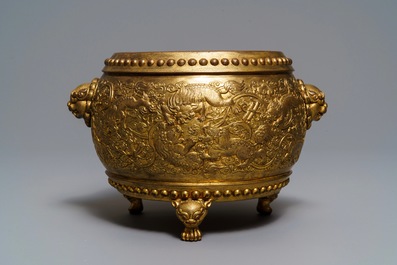 A Chinese gilt bronze tripod censer with buddhist lions, Qianlong mark, 19/20th C.