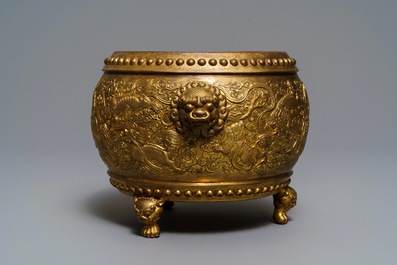 A Chinese gilt bronze tripod censer with buddhist lions, Qianlong mark, 19/20th C.