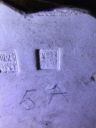 A Chinese famille rose group of two children, impressed marks, Republic, 20th C.