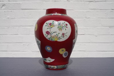 A fine Chinese famille rose ruby ground baluster vase with floral panels, Yongzheng