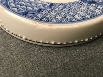 A Chinese blue and white covered bowl with ladies in a garden, Kangxi