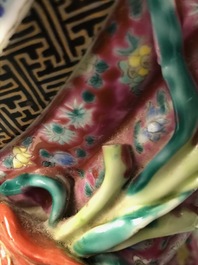A Chinese famille rose group of two children, impressed marks, Republic, 20th C.
