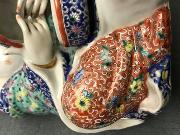 A Chinese famille rose group of two children, impressed marks, Republic, 20th C.