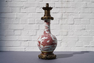 A Chinese underglaze red bottle-shaped 'dragon' vase with gilt-bronze mounts, 18/19th C.