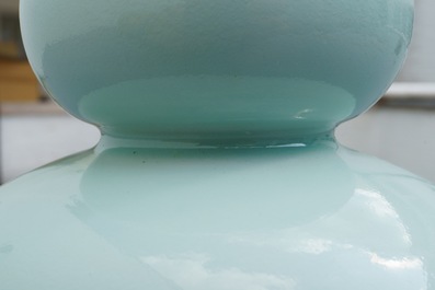 A Chinese monochrome celadon double gourd vase, Qianlong mark, 19th C.