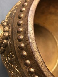 A Chinese gilt bronze tripod censer with buddhist lions, Qianlong mark, 19/20th C.
