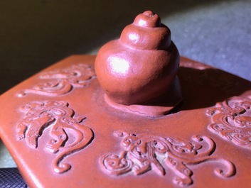 A large Chinese Yixing stoneware teapot with applied design, Kangxi