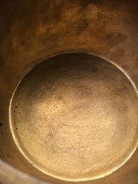 A Chinese gilt bronze tripod censer with buddhist lions, Qianlong mark, 19/20th C.