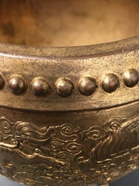 A Chinese gilt bronze tripod censer with buddhist lions, Qianlong mark, 19/20th C.