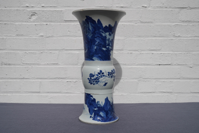 Een Chinese blauw-witte gu vaas met landschapsdecor, Kangxi merk en periode